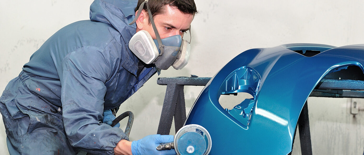 Proffesional car body repair, Painting blue bumper. Schlagwort(e): car painting, painting, airbrush, car, coat, color, crash, door, gun, lacquer, paintbox, professional, front, blue, repair, smart, spot, spray, fender, varnish, mask, masking, box, vehicle, work, body, compressor, bodywork, body, work, cover, garage, paintwork, paper, tape, service, worker, man, painter, booth, mechanic, silver, blue, blue bumper